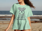 Light green t-shirt with cartoon schnauzer and text "SMART. SPUNKY. SCHNAUZY."