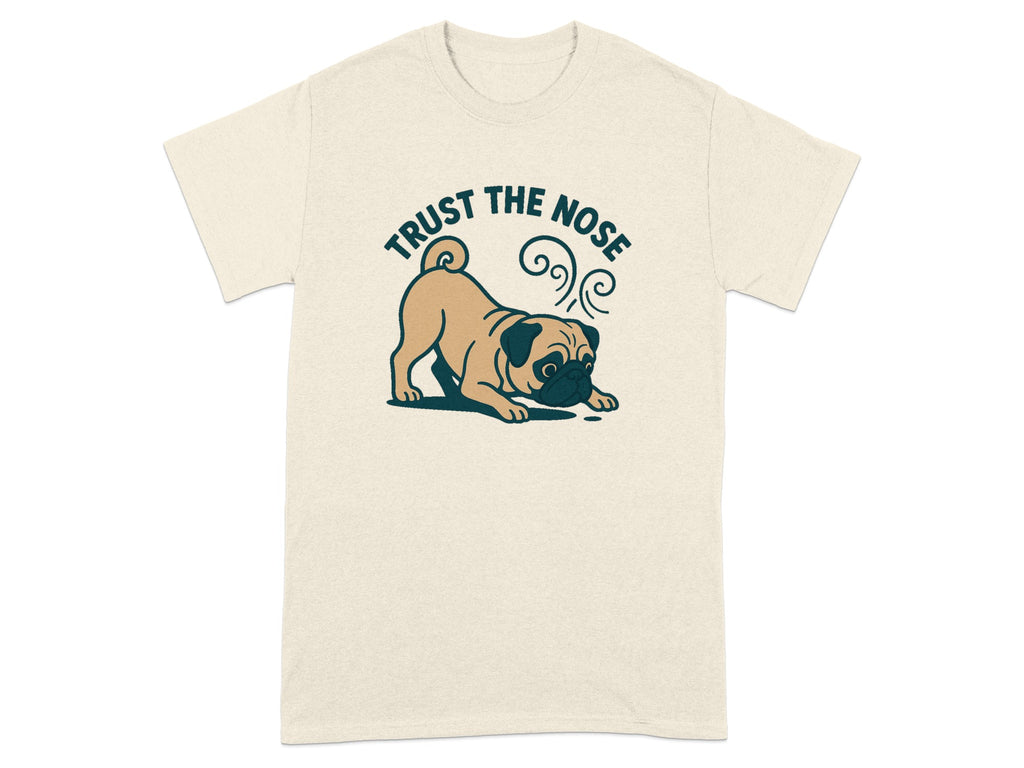 Cream t-shirt with a cartoon pug and the text "TRUST THE NOSE".