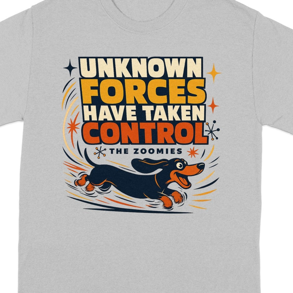 Grey t-shirt with graphic of dachshund running and text "UNKNOWN FORCES HAVE TAKEN CONTROL THE ZOOMIES".