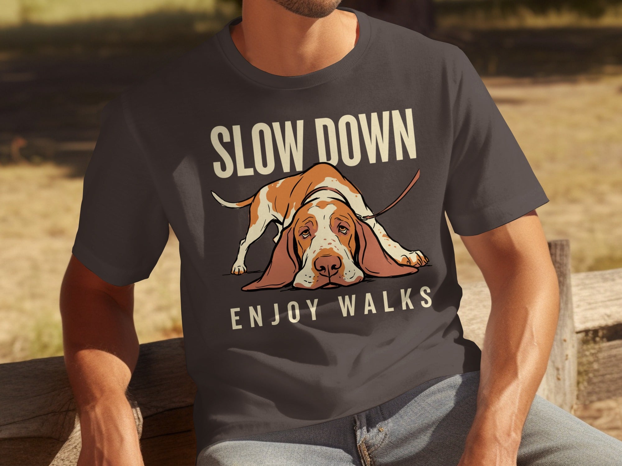 Dark grey t-shirt with text "SLOW DOWN ENJOY WALKS" and a sad Basset Hound.