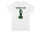 White t-shirt with a graphic of a poodle and "JUDGING YOU WITH PERFECT POSTURE".