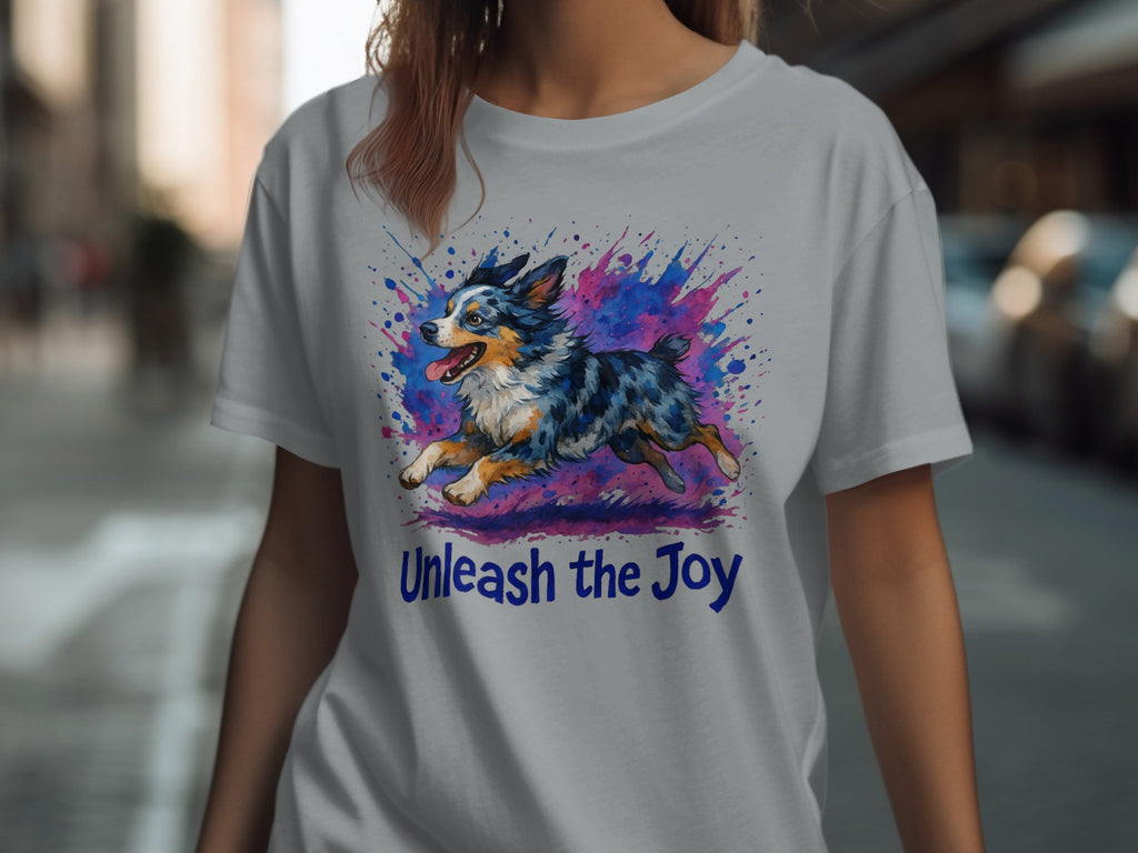 T-shirt with a watercolor Australian Shepherd dog graphic and "Unleash the Joy" text.