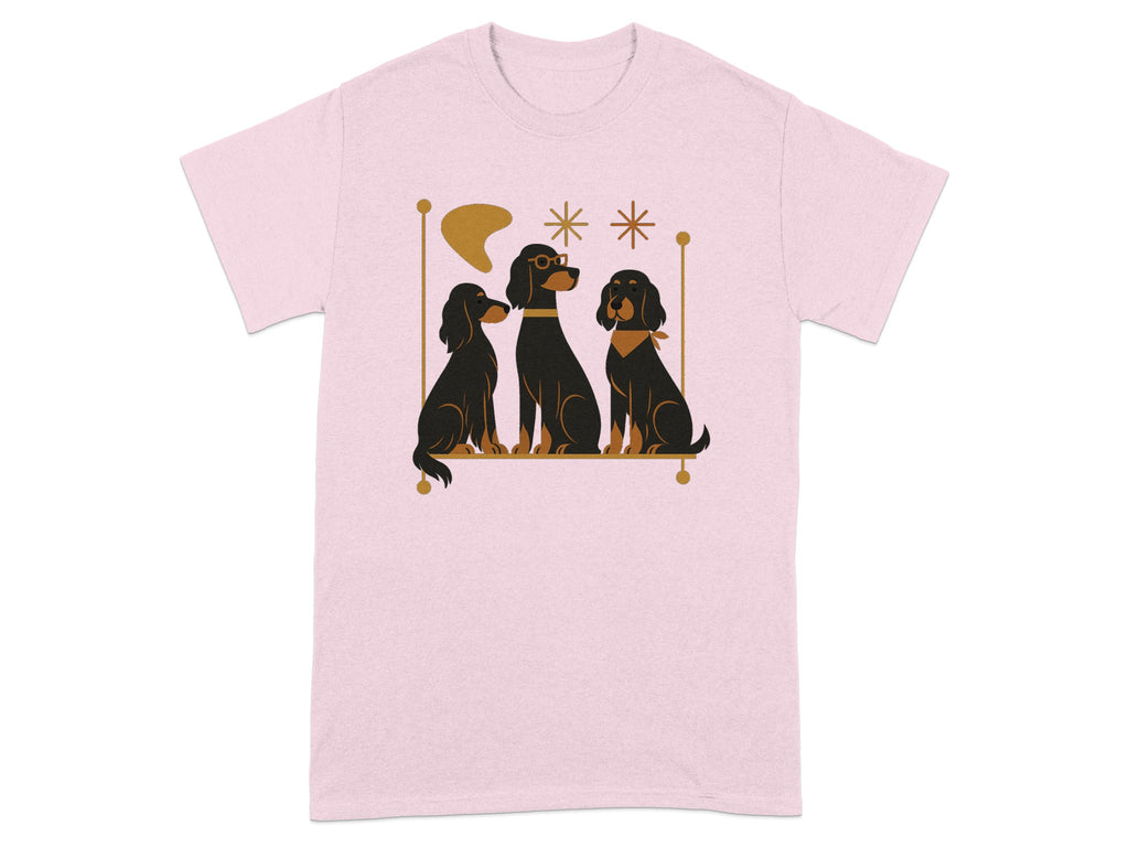 Three black dogs with stylized features sit on a shelf against a pink t-shirt.