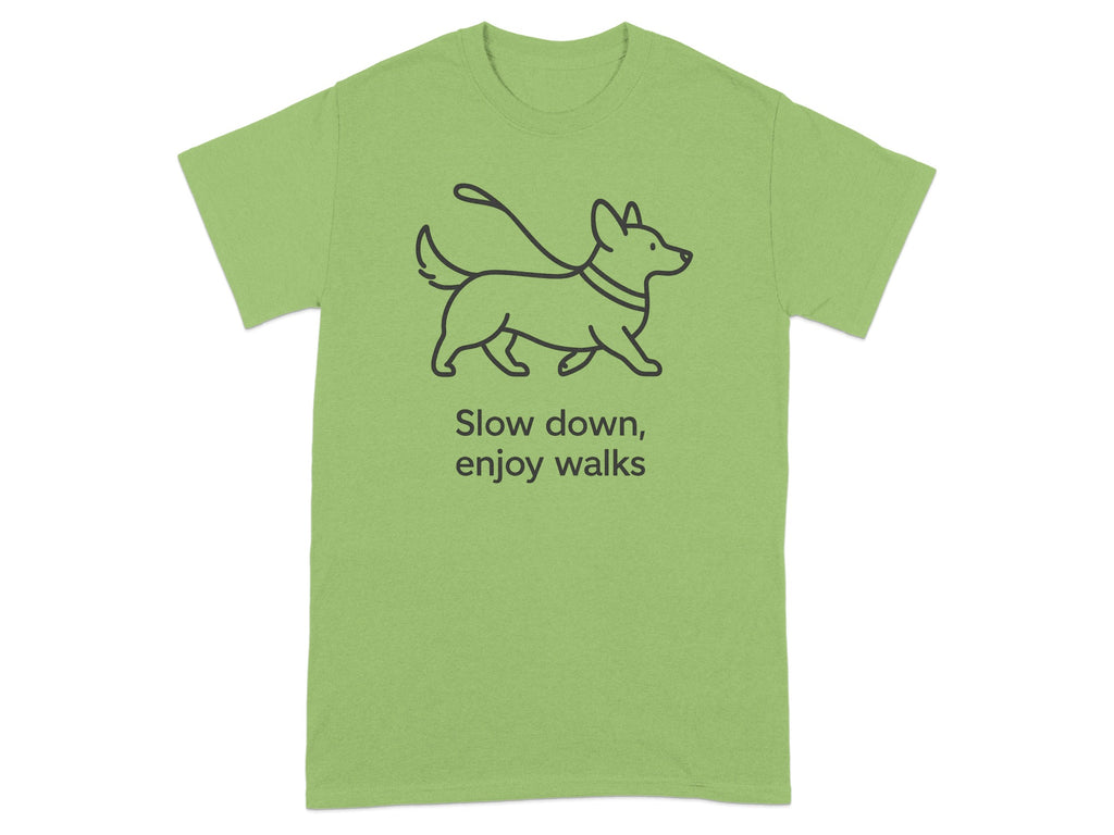 Light green t-shirt with a line drawing of a dog on a leash and the text "Slow down, enjoy walks".