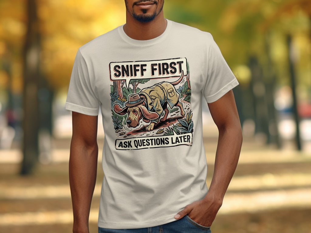 Cream t-shirt with dog illustration and text "Sniff First, Ask Questions Later".