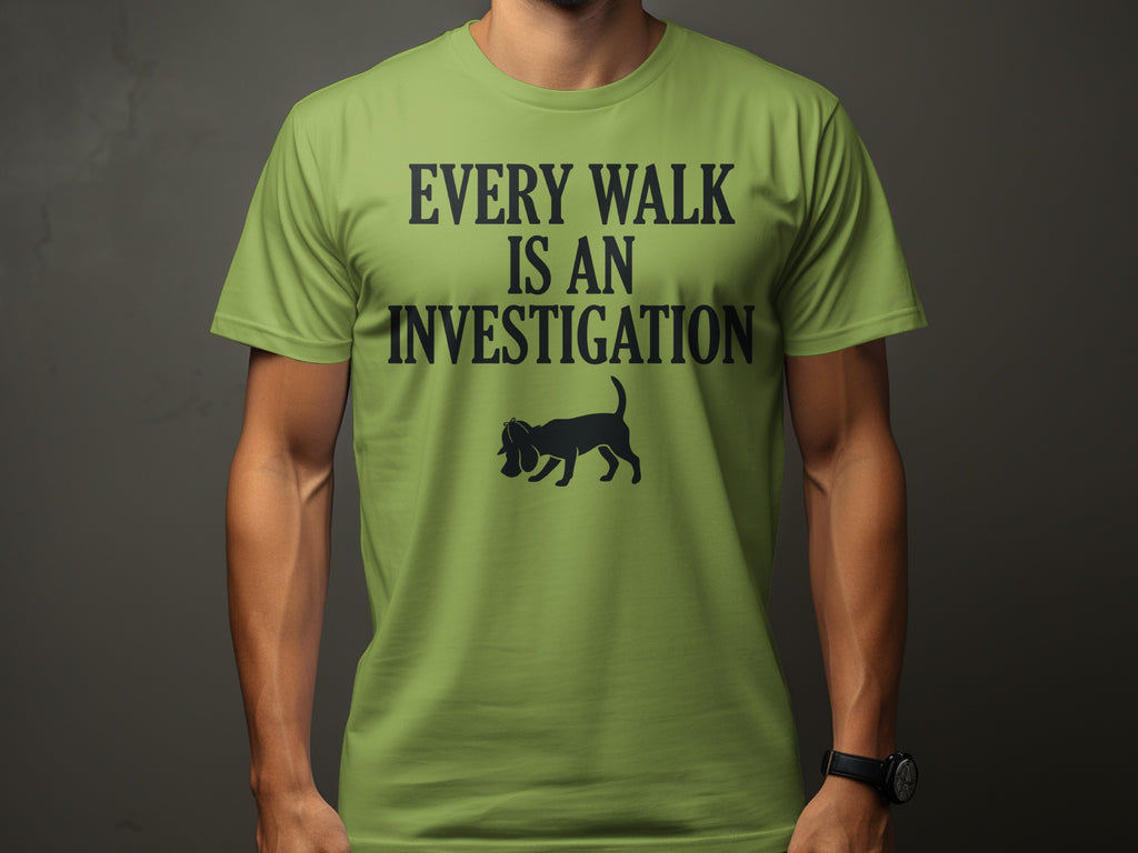 Green t-shirt with "Every Walk Is An Investigation" and a dog silhouette.