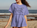 Lilac t-shirt with line drawing of a walking dog and text "Slow down, enjoy walks."