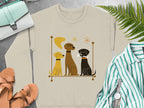 Three dogs in a line on a cream sweatshirt.