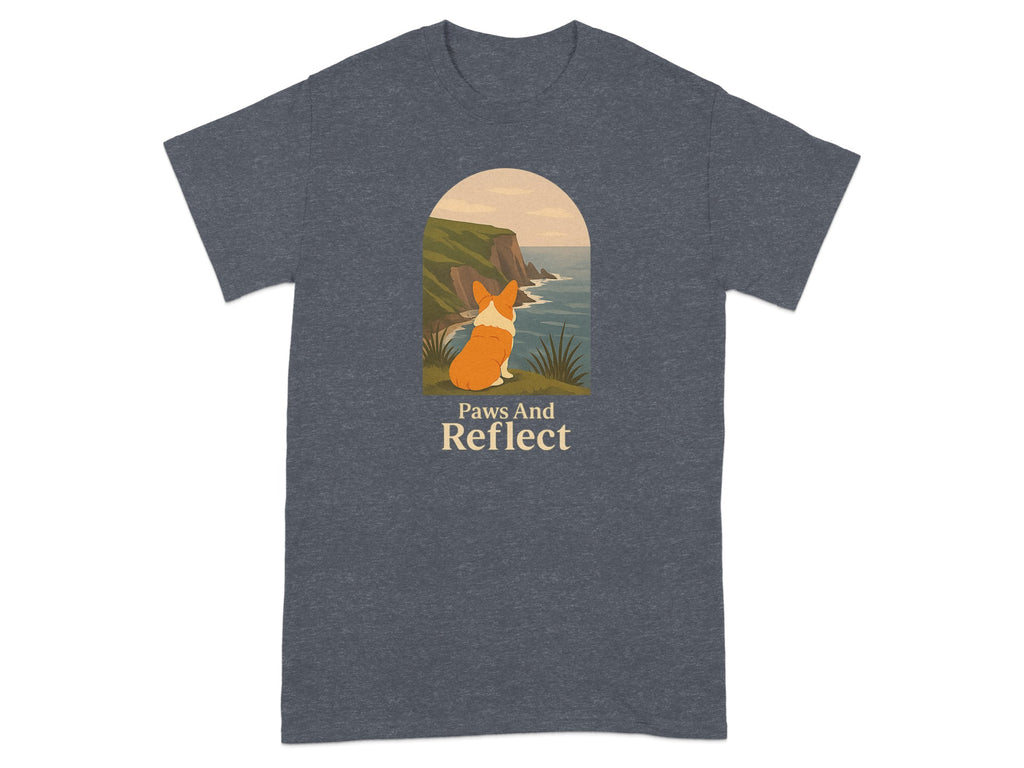 T-shirt with a corgi looking at the ocean over cliffs, text says "Paws And Reflect".