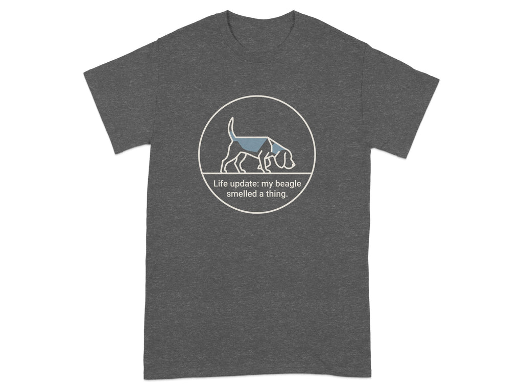 Dark grey t-shirt with a circular logo and text "Life update: my beagle smelled a thing."