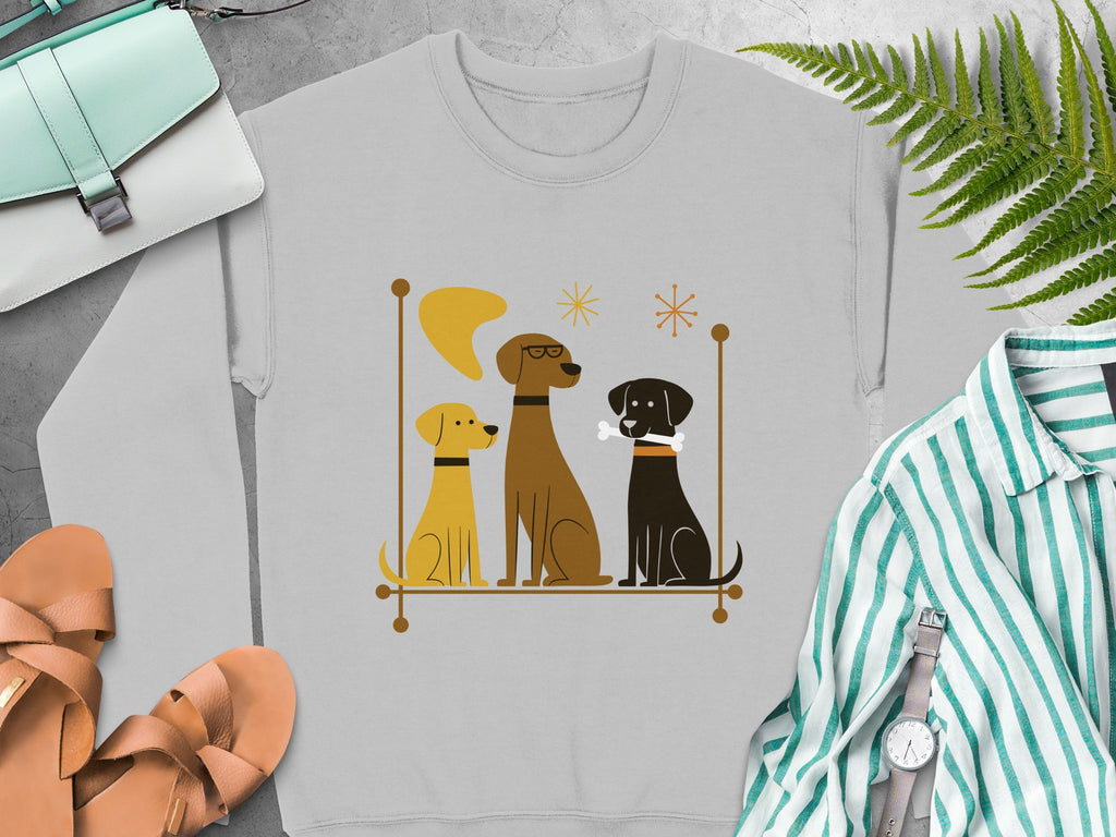 Graphic sweatshirt with three cartoon dogs, two brown and one black, sitting.