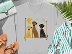 Graphic sweatshirt with three cartoon dogs, two brown and one black, sitting.