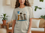 Light beige t-shirt with three cartoon dogs in a framed design.