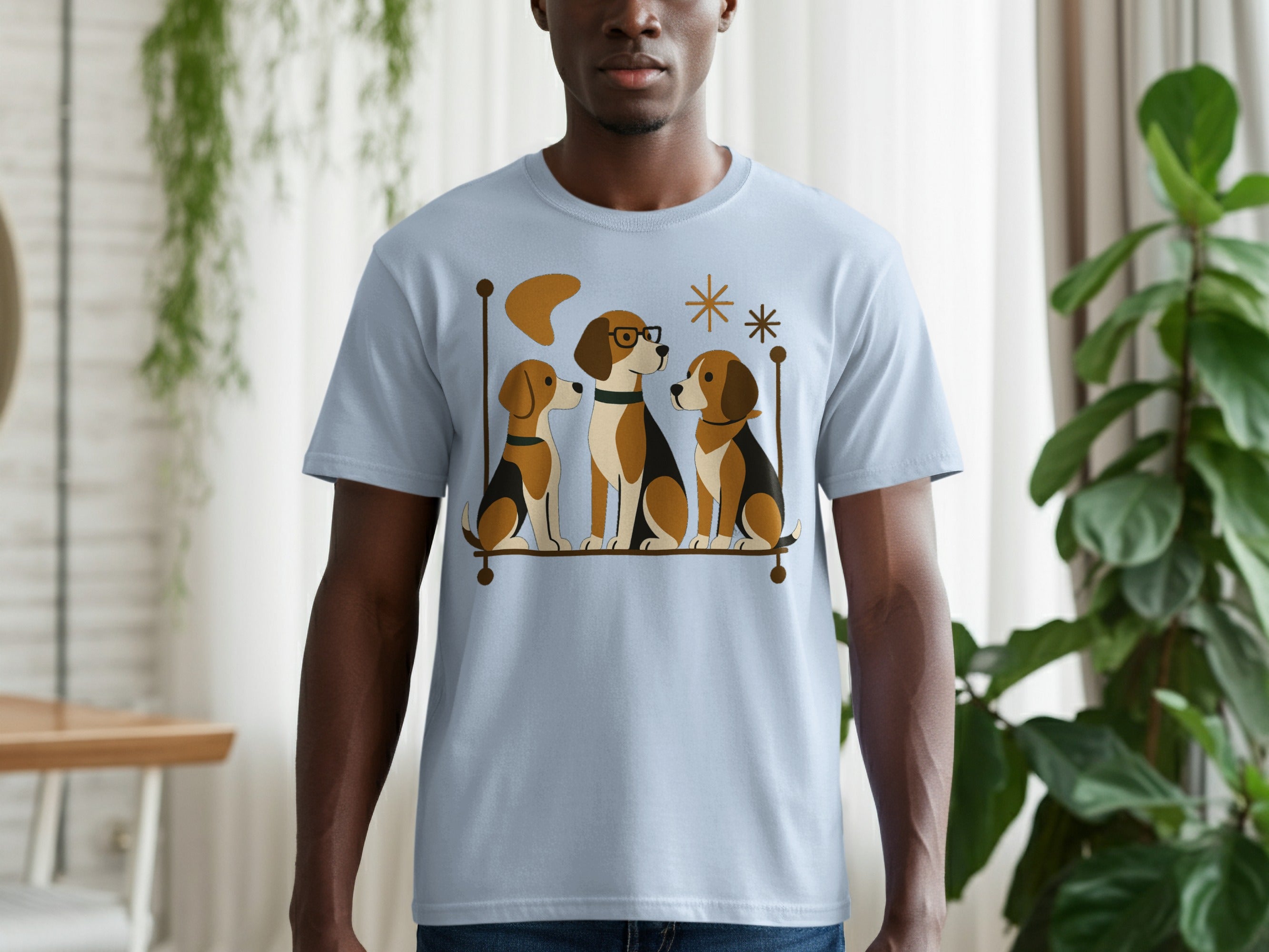 Light blue t-shirt with graphic art of three beagles sitting on a ledge.