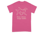 Pink t-shirt with a line-art dog on a leash and the text "Slow down, enjoy walks".