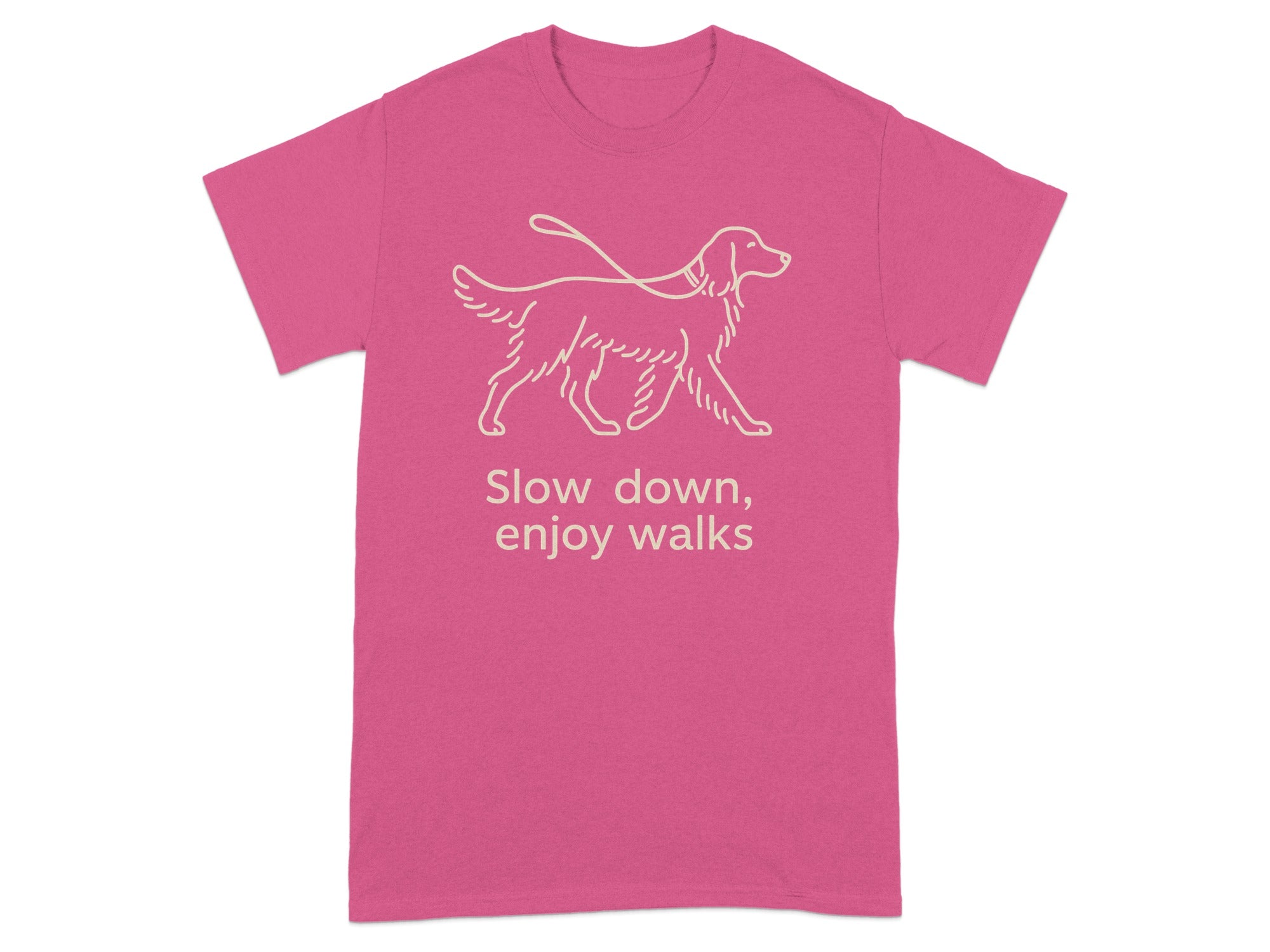 Pink t-shirt with a line-art dog on a leash and the text "Slow down, enjoy walks".