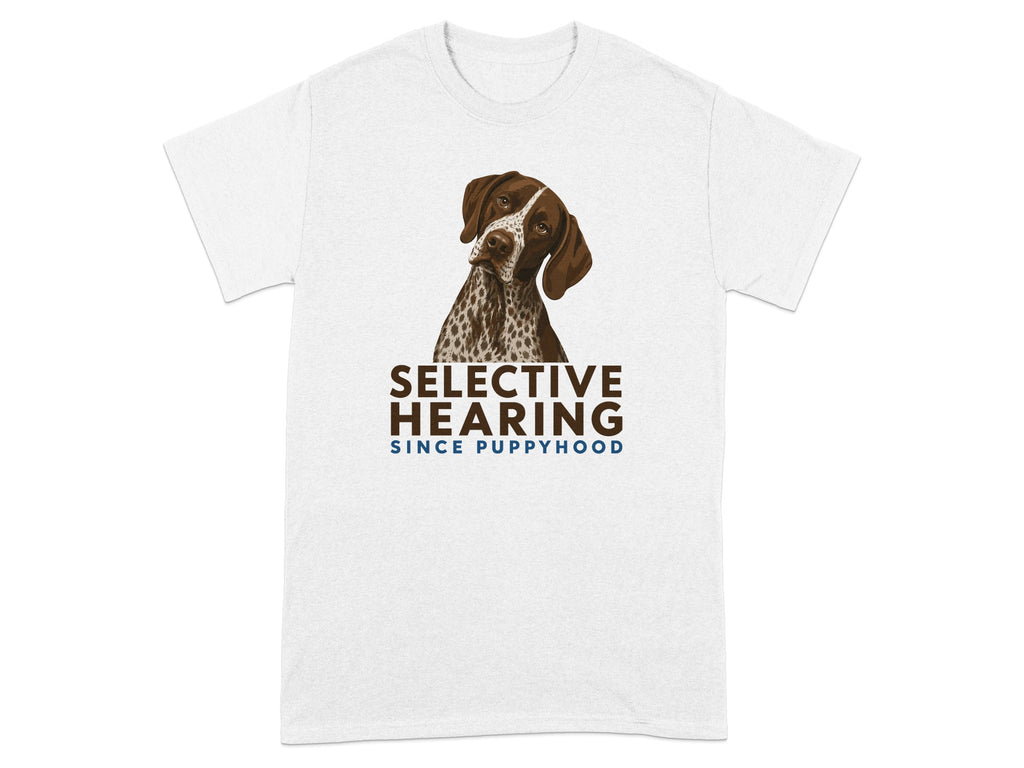 German Shorthaired Pointer wearing a shirt with "SELECTIVE HEARING SINCE PUPPYHOOD" text.
