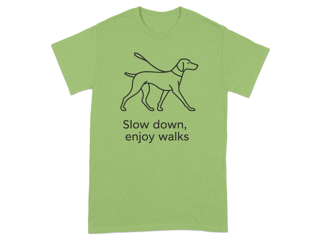Green t-shirt with line drawing of a dog on a leash and text "Slow down, enjoy walks".