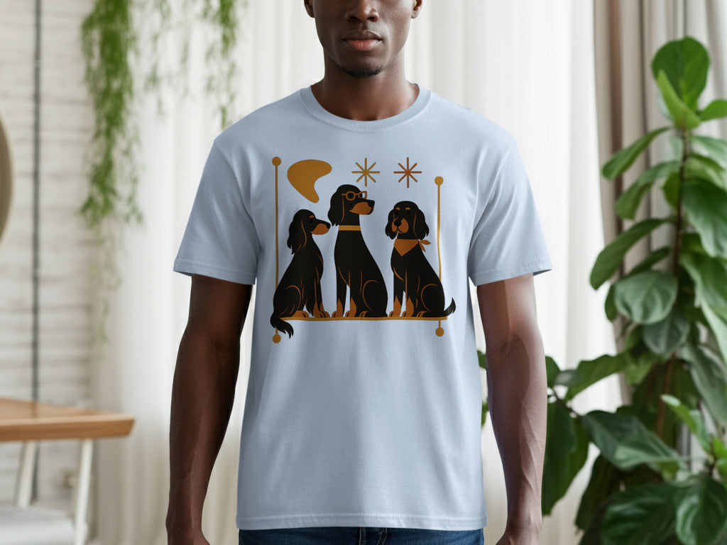 Light blue t-shirt with a graphic of three black dogs with gold accents.