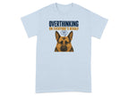 Light blue t-shirt with German Shepherd wearing glasses, text reads "Overthinking on everyone's behalf".