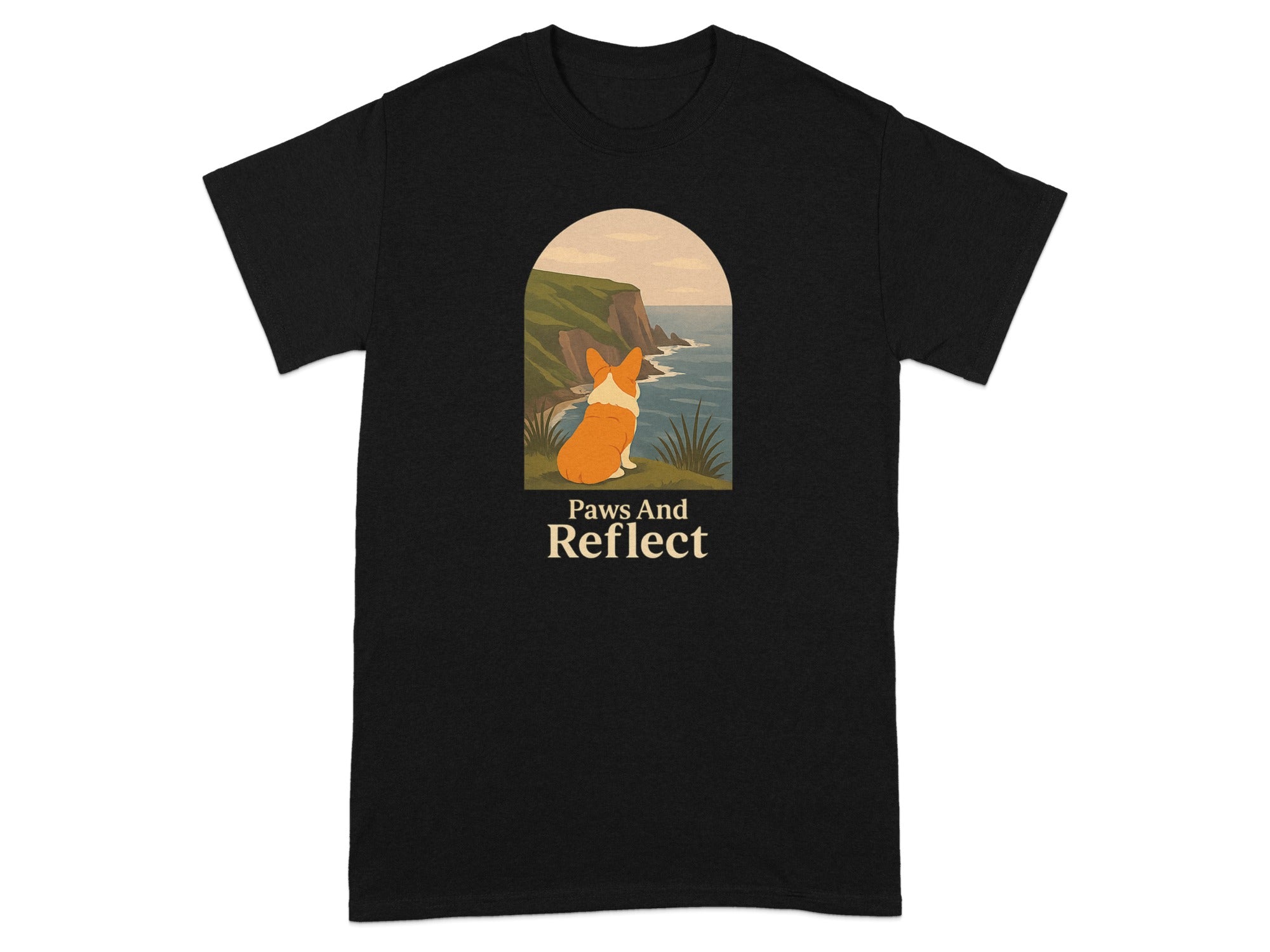 Black t-shirt with a corgi looking at a cliffside ocean view with "Paws And Reflect" text.