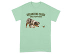 Light green t-shirt with a puppy chasing a butterfly and the text "Organizing Chaos Since Puppyhood."