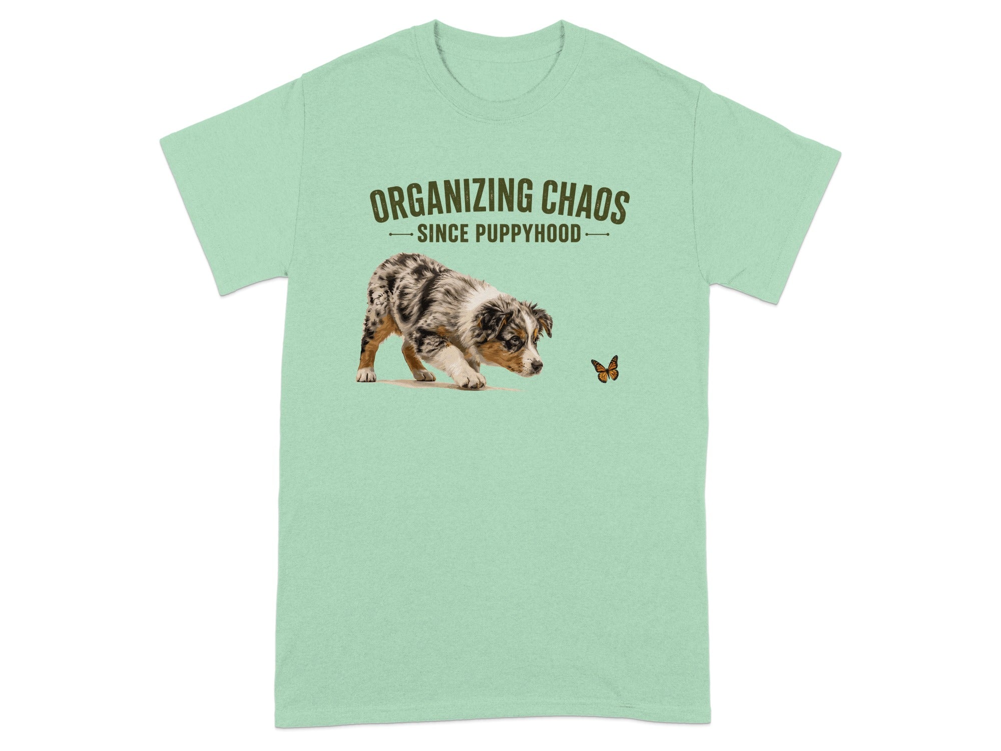 Light green t-shirt with a puppy chasing a butterfly and the text "Organizing Chaos Since Puppyhood."
