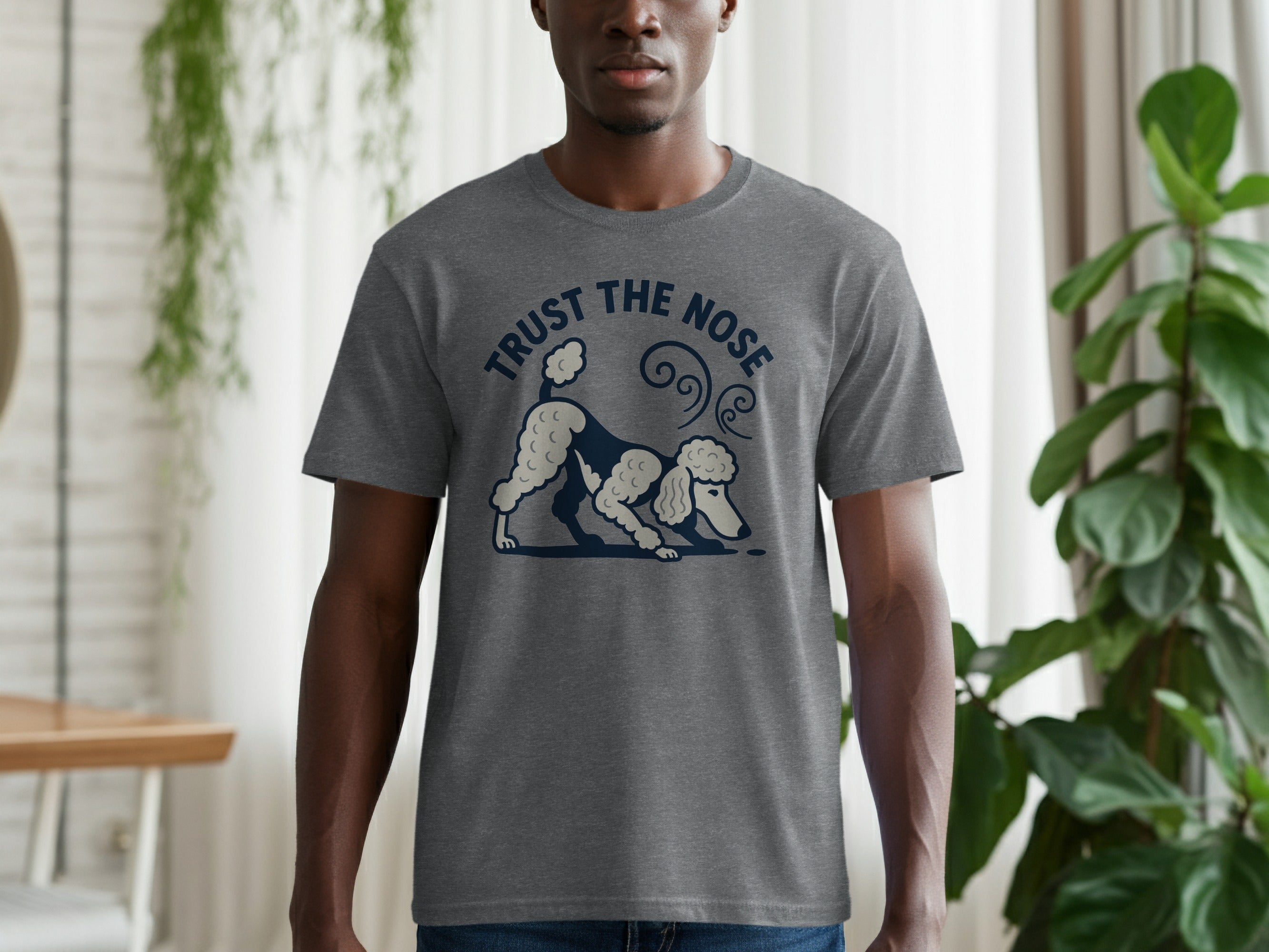 Grey t-shirt with a dark blue graphic of a poodle sniffing the ground and text "TRUST THE NOSE".