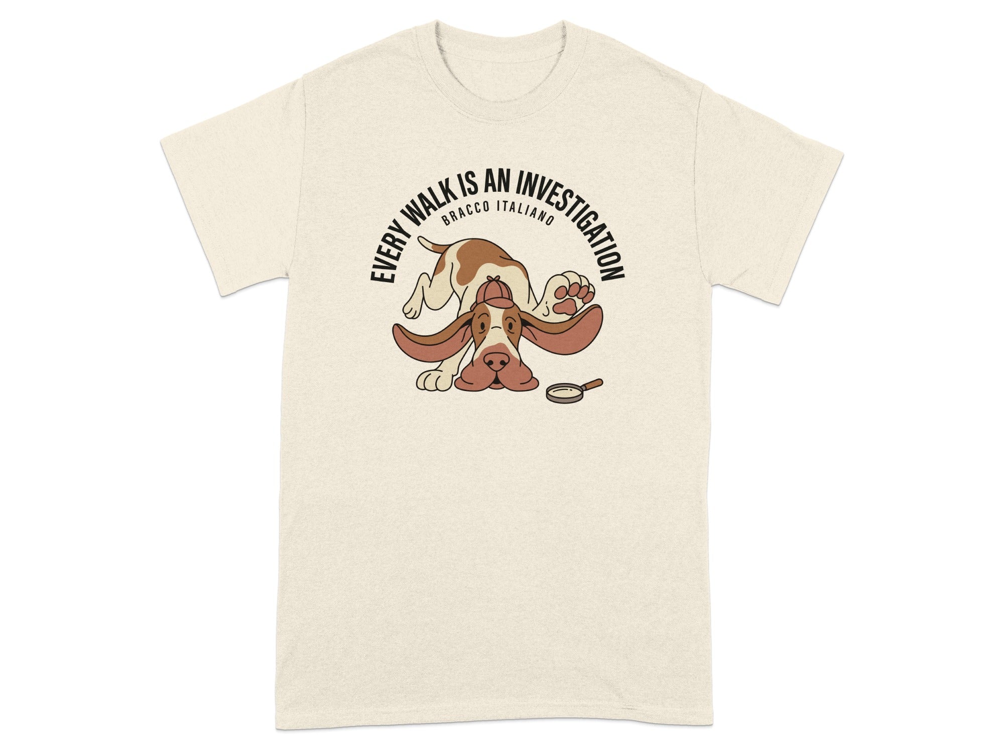 Beige t-shirt with a cartoon dog wearing a detective hat and a magnifying glass.