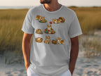 Illustration of corgis playing with balls of yarn and baskets on a white t-shirt.