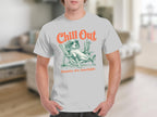 White t-shirt with graphic of a dog wearing sunglasses relaxing in a beach chair.