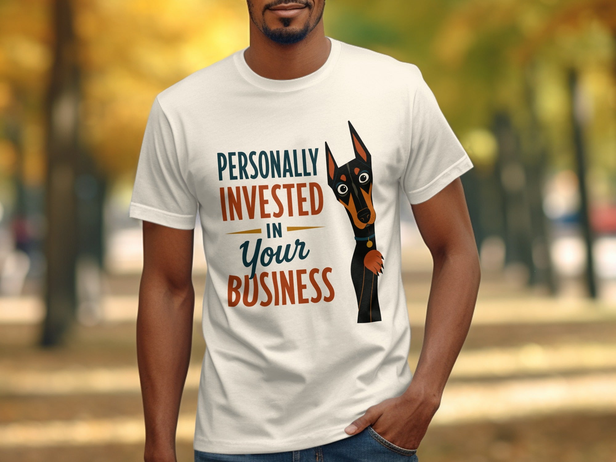 White t-shirt with "Personally Invested In Your Business" and a dog illustration.