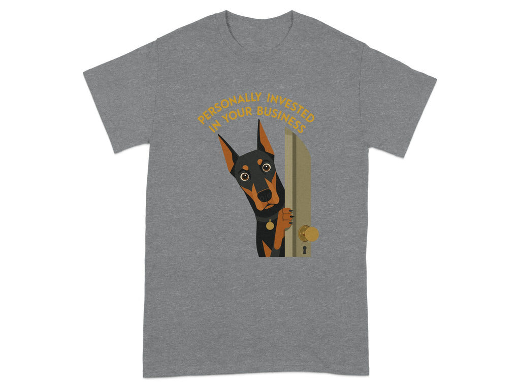 Black and tan dog peeking from behind a door on a grey t-shirt.