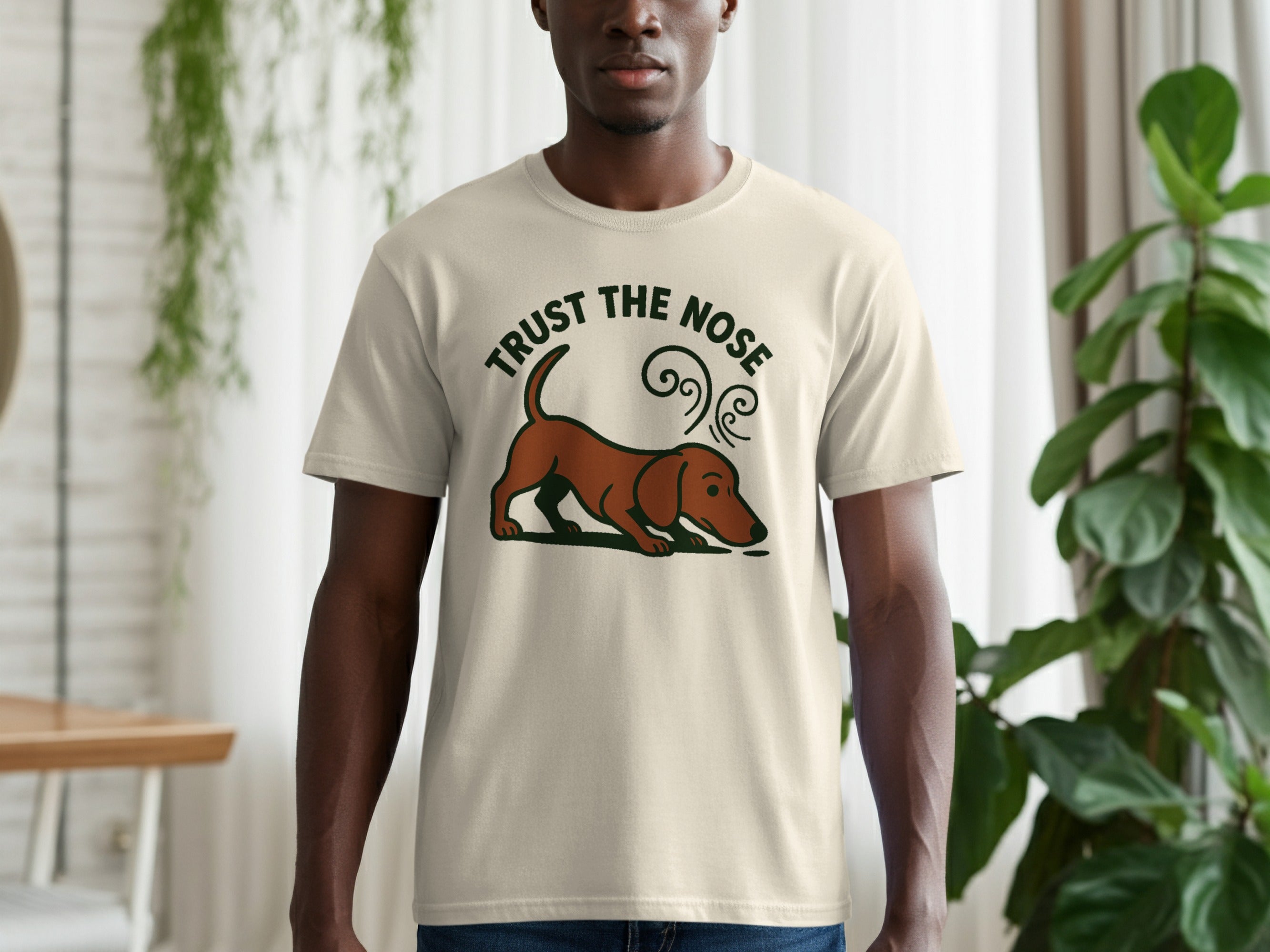 Cream t-shirt with "TRUST THE NOSE" text and dachshund graphic