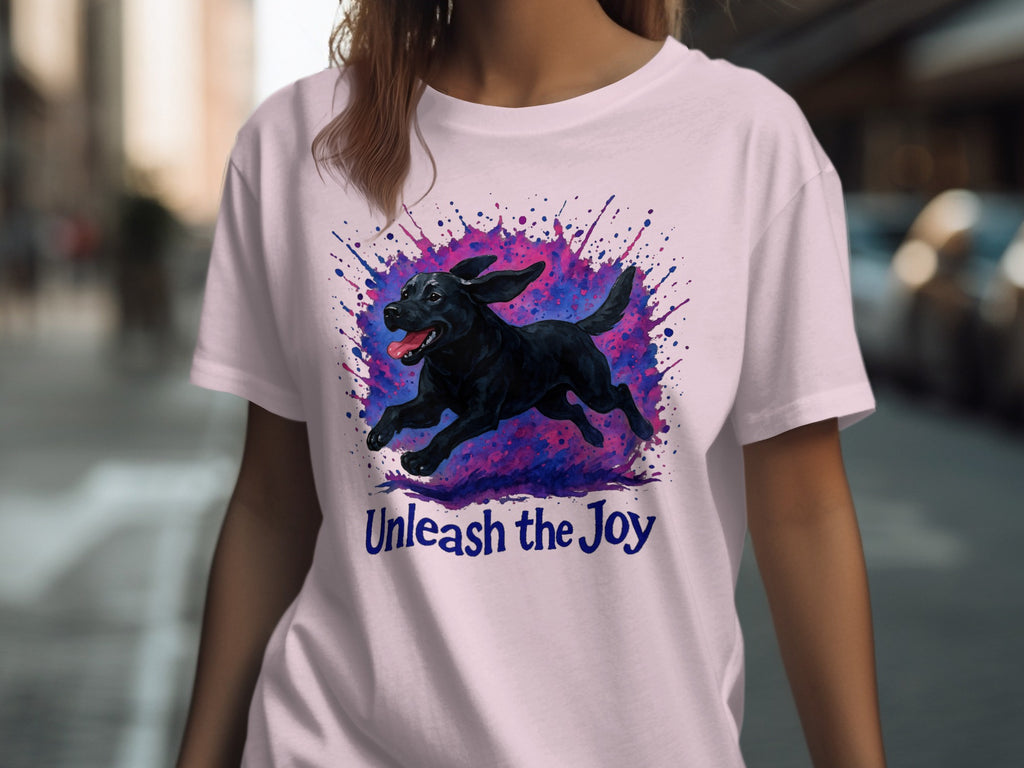 Black dog in mid-run with colorful paint splatters and text "Unleash the Joy".