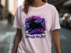 Black dog in mid-run with colorful paint splatters and text "Unleash the Joy".