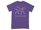 Purple t-shirt with line drawing of a dog and the text "Slow down, enjoy walks."