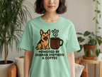 Green t-shirt features a German Shepherd dog and coffee cup graphic with text.