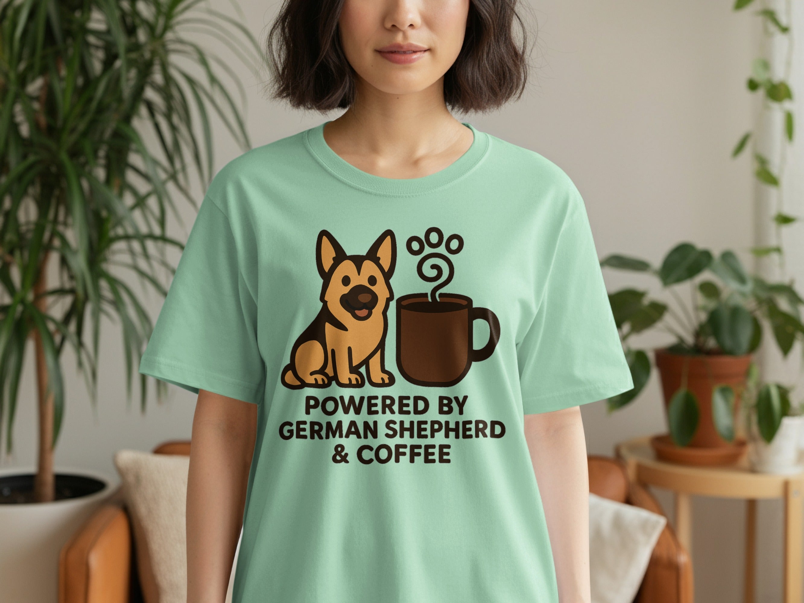 Green t-shirt features a German Shepherd dog and coffee cup graphic with text.