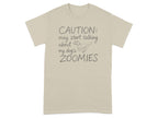 Beige t-shirt with "CAUTION: may start talking about my dog's ZOOMIES" text and dog graphic.