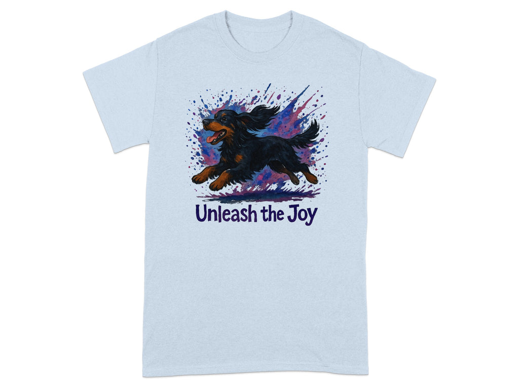 Light blue t-shirt with black and tan dog running, watercolor splashes and text "Unleash the Joy".