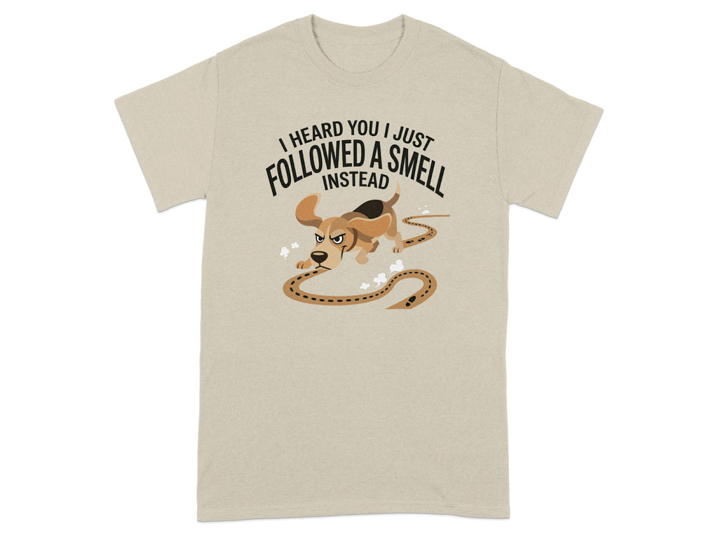 Beige t-shirt with a cartoon dog following a scent trail.