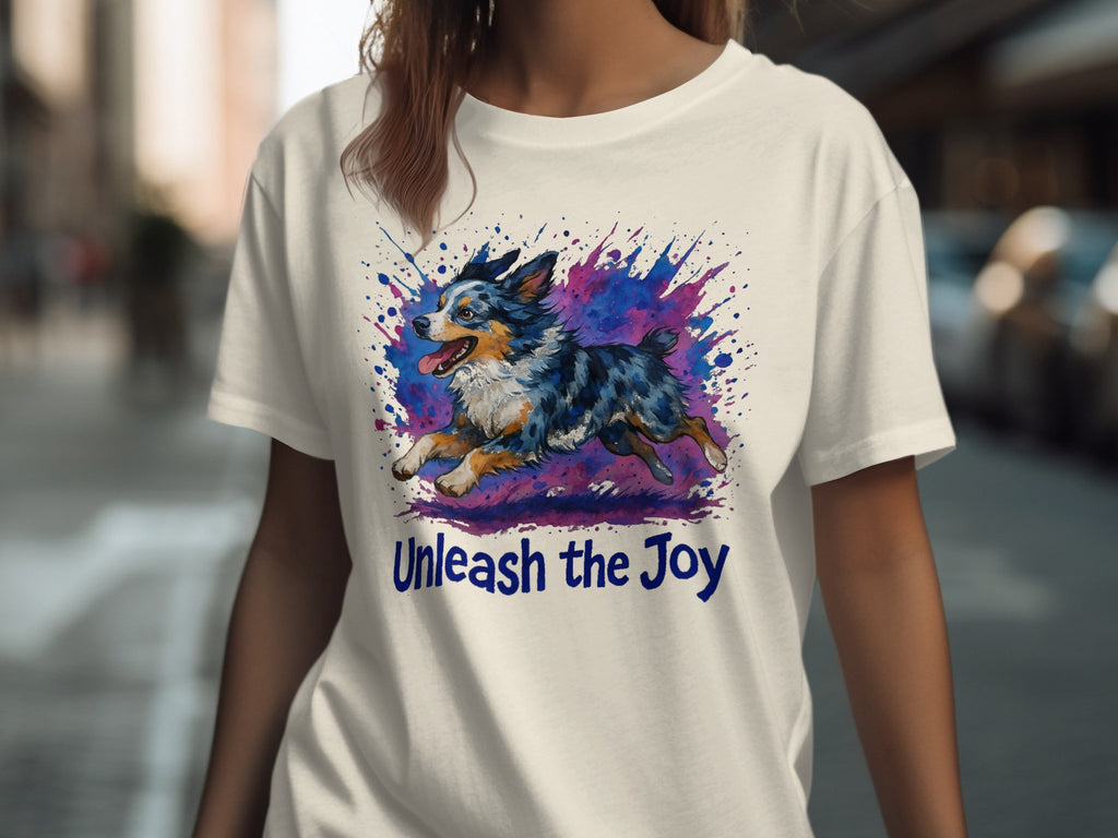 White t-shirt with watercolor dog and "Unleash the Joy" text.