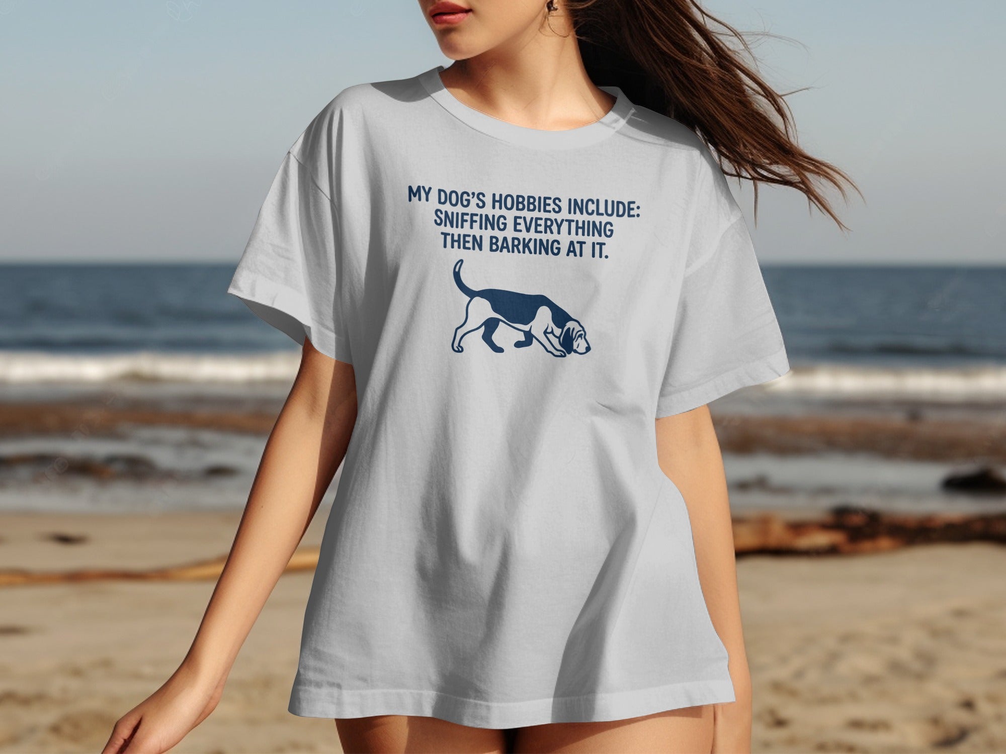 Gray t-shirt with a blue dog graphic and text "MY DOG'S HOBBIES INCLUDE: SNIFFING EVERYTHING THEN BARKING AT IT."