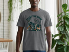A person wears a grey t-shirt with a dog graphic and "Trust the Nose" text.