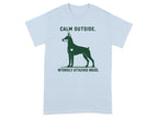Light blue t-shirt with Doberman silhouette and text "CALM OUTSIDE. INTENSELY ATTACHED INSIDE."