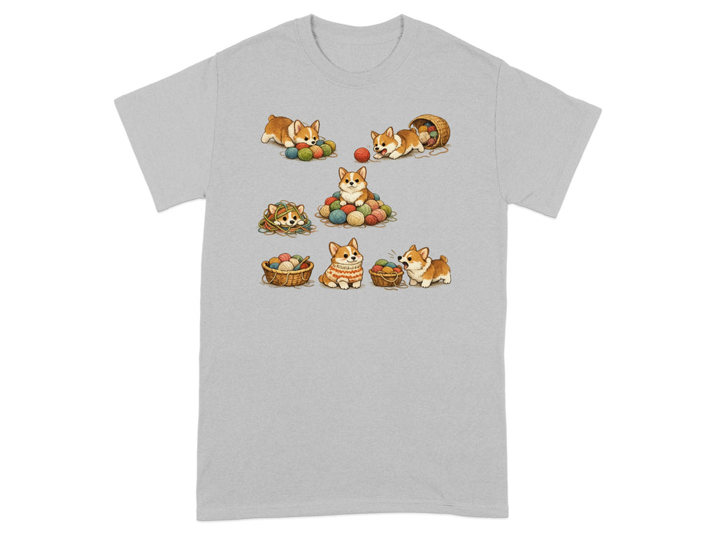 Seven cartoon corgis play with balls of yarn and baskets on a gray t-shirt.