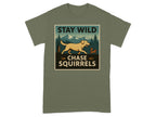 Green t-shirt with "STAY WILD CHASE SQUIRRELS" graphic featuring dog and squirrel.
