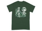 Three labradors in a forest under a full moon printed on a dark green t-shirt.