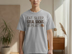 Grey t-shirt with "EAT. SLEEP. REPEAT. SOCKS." text and a small dog icon.